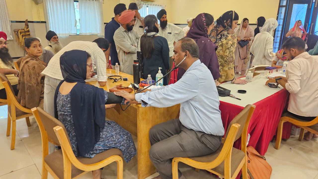 Doctor checking an attendee at the Health Checkup Camp in Vapi